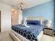 Bright bedroom with king bed and en-suite bathroom access at 547 Marcello Blvd, Kissimmee, FL 34746