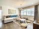Relaxing living room featuring a sectional sofa and stylish decor at 547 Marcello Blvd, Kissimmee, FL 34746