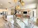 Modern dining room with glass table and unique lighting at 547 Marcello Blvd, Kissimmee, FL 34746