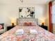 King-size bedroom with floral bedding and plenty of natural light at 547 Marcello Blvd, Kissimmee, FL 34746