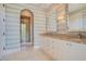 Spa-like bathroom featuring a walk-in shower and striped wall design at 5174 Vardon Dr, Windermere, FL 34786