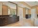 Bathroom with double vanity and large mirror at 5174 Vardon Dr, Windermere, FL 34786