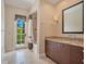 Bathroom with shower, vanity, and private access to balcony at 5174 Vardon Dr, Windermere, FL 34786