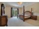 Elegant bedroom with a king-size bed and private balcony access at 5174 Vardon Dr, Windermere, FL 34786