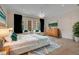 Luxurious bedroom with king-size bed, sitting area, and private balcony at 5174 Vardon Dr, Windermere, FL 34786