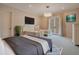 Bedroom featuring two twin beds, a large TV, and private balcony access at 5174 Vardon Dr, Windermere, FL 34786