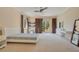 Bright bedroom with a queen-size bed and private balcony access at 5174 Vardon Dr, Windermere, FL 34786