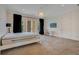 Charming bedroom with a queen-size bed and private balcony at 5174 Vardon Dr, Windermere, FL 34786