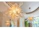 Close-up of a unique, modern glass chandelier at 5174 Vardon Dr, Windermere, FL 34786