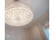 Large crystal chandelier illuminates the room at 5174 Vardon Dr, Windermere, FL 34786