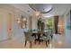 Elegant dining room with a large table and modern light fixtures at 5174 Vardon Dr, Windermere, FL 34786