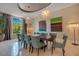 Formal dining room with large table, seating for eight, and modern chandelier at 5174 Vardon Dr, Windermere, FL 34786