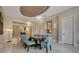 Spacious dining room with large windows and modern light fixtures at 5174 Vardon Dr, Windermere, FL 34786