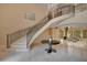 Elegant entryway with a sweeping staircase and marble flooring at 5174 Vardon Dr, Windermere, FL 34786