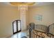 Grand entryway with a crystal chandelier and curved staircase at 5174 Vardon Dr, Windermere, FL 34786