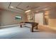 Well-lit game room featuring a pool table and multiple TVs at 5174 Vardon Dr, Windermere, FL 34786