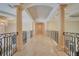Long hallway with arched ceilings and marble flooring at 5174 Vardon Dr, Windermere, FL 34786