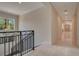 Elegant hallway with marble floors and an ornate railing at 5174 Vardon Dr, Windermere, FL 34786