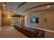 Relaxing home theater with sectional sofa and wall-mounted TV at 5174 Vardon Dr, Windermere, FL 34786