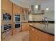 Gourmet kitchen with stainless steel appliances and wood cabinetry at 5174 Vardon Dr, Windermere, FL 34786