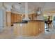 Modern kitchen with curved island and stainless steel appliances at 5174 Vardon Dr, Windermere, FL 34786