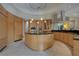 Island kitchen with stainless steel appliances and light wood cabinets at 5174 Vardon Dr, Windermere, FL 34786
