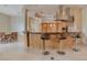 Modern kitchen with a large curved island and breakfast bar seating at 5174 Vardon Dr, Windermere, FL 34786