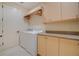 Bright laundry room with ample storage and countertop space at 5174 Vardon Dr, Windermere, FL 34786