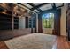 Spacious library with built-in shelving, hardwood floors, and a large window at 5174 Vardon Dr, Windermere, FL 34786