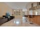 Bright living room with large windows and a modern entertainment center at 5174 Vardon Dr, Windermere, FL 34786