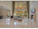 Grand living room with high ceilings, fireplace, and access to backyard at 5174 Vardon Dr, Windermere, FL 34786