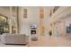 Open living room with high ceilings and a fireplace at 5174 Vardon Dr, Windermere, FL 34786