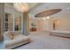 Luxurious main bedroom with large windows and sitting area at 5174 Vardon Dr, Windermere, FL 34786