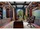 Opulent home office with dark wood finishes and large window at 5174 Vardon Dr, Windermere, FL 34786