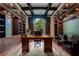 Luxurious home office with built-in bookshelves and a large window at 5174 Vardon Dr, Windermere, FL 34786