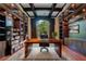 Spacious home office with built-in shelving and hardwood floors at 5174 Vardon Dr, Windermere, FL 34786