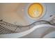 View of a curved staircase with wrought iron railing from above at 5174 Vardon Dr, Windermere, FL 34786