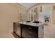 Modern wet bar with wine cooler and granite top at 5174 Vardon Dr, Windermere, FL 34786