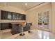 Home bar with granite countertop and dark cabinets at 5174 Vardon Dr, Windermere, FL 34786