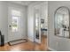 Light and bright entryway with wood floors and pocket doors at 934 Mckinnon Sq, Winter Garden, FL 34787