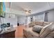 Bright living room with tiled floors and comfy sectional sofa at 8116 Powell Dr, Orlando, FL 32822