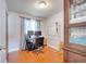 Bright home office features a large desk, two monitors, and ample floor space at 8116 Powell Dr, Orlando, FL 32822