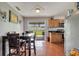 Eat-in kitchen with wood cabinets, granite counters, and tile floors at 8116 Powell Dr, Orlando, FL 32822