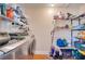 Laundry room with shelving for storage and washer/dryer at 8116 Powell Dr, Orlando, FL 32822