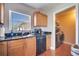 Kitchen with access to laundry and pantry at 8116 Powell Dr, Orlando, FL 32822
