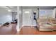 Home entryway with tiled floors, leading to living room and view of the backyard at 8116 Powell Dr, Orlando, FL 32822
