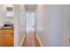 Long hallway with tile floors and access to bedrooms and bathroom at 8116 Powell Dr, Orlando, FL 32822