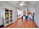 Home office with tile floors and built-in shelving at 8116 Powell Dr, Orlando, FL 32822