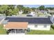 Aerial view showing home with solar panels, patio, and backyard at 8116 Powell Dr, Orlando, FL 32822