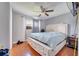 Main bedroom with king-size bed, ceiling fan, and en-suite bathroom at 8116 Powell Dr, Orlando, FL 32822